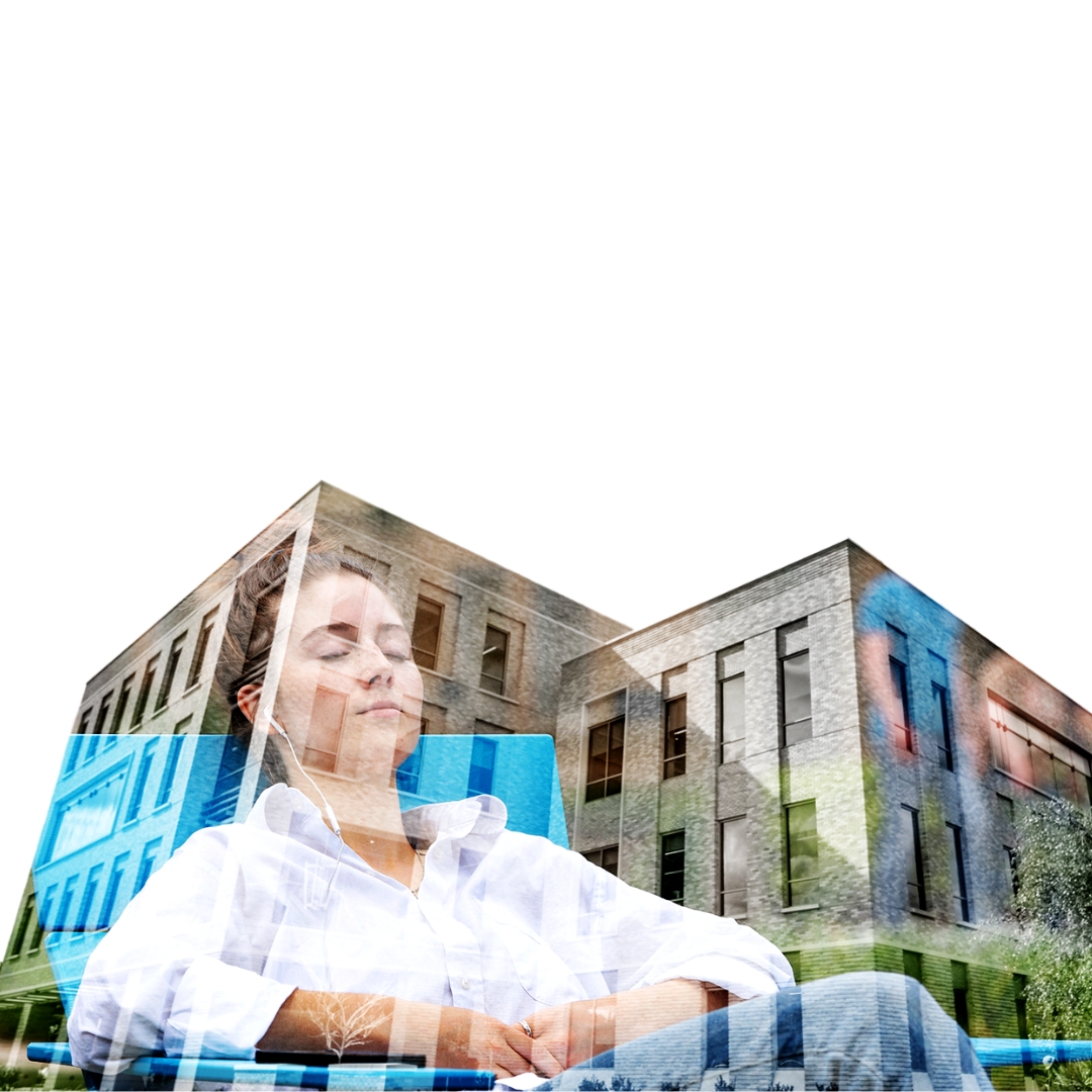 A student relaxing on a sunny day with her eyes close, listening to music with headphones, visible within the silhouette of the Student Services Building.